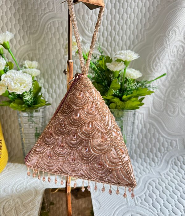 This rose gold beaded bag is a total head-turner! The delicate